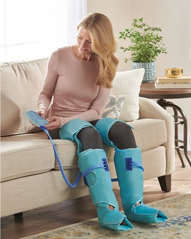 Woman sitting in chair with leg wrap