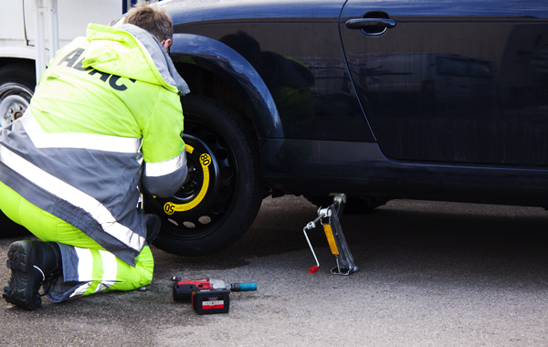 man changing car tire
